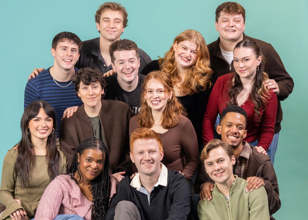 Pioneer Theatre Review: "Ten Brave Seconds" and the Courage of Staying in the Room 5 A group portrait of fourteen young adults smiling together against a teal background.