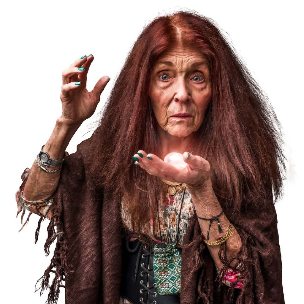 PYG Review: Becky, Nurse of Salem—Returning to the Past to Tell History Differently 9 An elderly woman with long, wild red hair, wearing a dark shawl over a colorful dress, holds a glowing orb in her palm while looking intently at it.