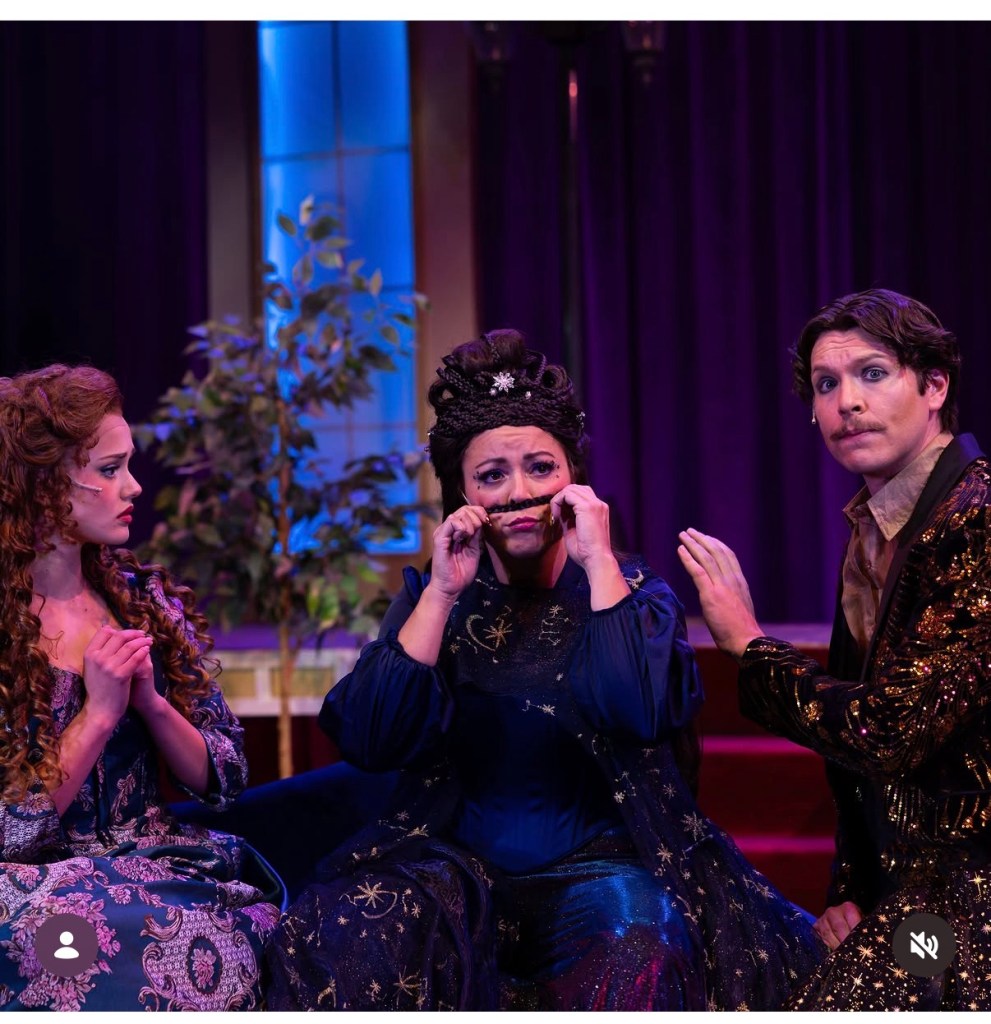 Three actors in a theatrical scene, expressing emotions related to a mystery, with one wearing a playful mustache.
